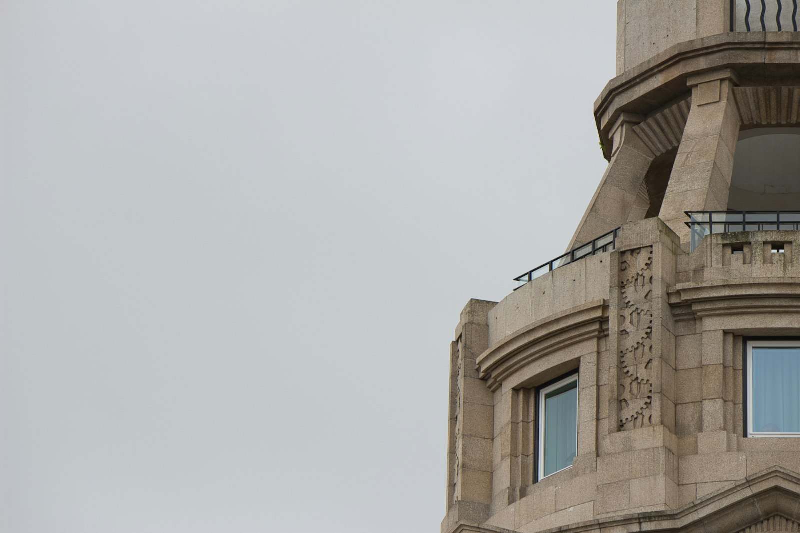 Carved granite architecture against an overcast sky